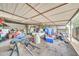 A well lit storage shed featuring a metal roof and a collection of assorted materials and equipment at 6215 E Surrey Ave, Scottsdale, AZ 85254