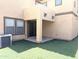 Private backyard patio area with well maintained faux grass and access to sliding glass door at 6388 W Ruth Ave, Glendale, AZ 85302