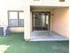 Private backyard patio area with well maintained faux grass and access to sliding glass door at 6388 W Ruth Ave, Glendale, AZ 85302