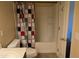 Functional bathroom with tub-shower combination and neutral colored shower curtain and tile floor at 6388 W Ruth Ave, Glendale, AZ 85302
