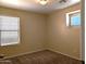 Inviting bedroom with neutral tones, plush carpet, and multiple windows for ample natural light at 6388 W Ruth Ave, Glendale, AZ 85302