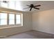 Bright bedroom with multiple windows, a ceiling fan, and generous space for furnishings at 6388 W Ruth Ave, Glendale, AZ 85302