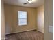 Comfortable bedroom featuring neutral walls, carpet flooring, and bright window with natural light at 6388 W Ruth Ave, Glendale, AZ 85302