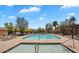 A view of the community pool and spa, with plenty of lounge chairs at 6388 W Ruth Ave, Glendale, AZ 85302