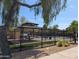 Community pool area featuring a pool, covered seating, lounge chairs and mature trees at 6388 W Ruth Ave, Glendale, AZ 85302