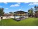 Community pool area with shade, table, chairs, and lounge chairs at 6388 W Ruth Ave, Glendale, AZ 85302