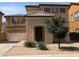 Charming two-story home showcasing well-maintained landscaping, a tile roof and a two-car garage at 6388 W Ruth Ave, Glendale, AZ 85302