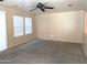 Spacious living room enhanced by large windows that flood the room with abundant natural light at 6388 W Ruth Ave, Glendale, AZ 85302