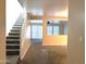 Welcoming staircase adjacent to the living room with an open-concept design and ample natural light at 6388 W Ruth Ave, Glendale, AZ 85302