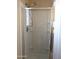 Tiled walk-in shower with glass door and convenient built-in shelving for an organized and modern space at 6388 W Ruth Ave, Glendale, AZ 85302