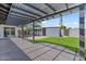 View of the backyard with a covered patio and artificial grass at 6908 E Windsor Ave, Scottsdale, AZ 85257