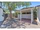Pergola on a brick surface with gravel surrounding the patio and artificial lawn at 6908 E Windsor Ave, Scottsdale, AZ 85257