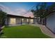 Exterior view of the backyard with an artificial lawn at 6908 E Windsor Ave, Scottsdale, AZ 85257