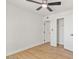 Bedroom with wood floor, closet, white walls, and view into the hallway at 6908 E Windsor Ave, Scottsdale, AZ 85257