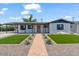 Inviting single-story home with manicured lawn, stylish exterior paint, and appealing front entrance at 6908 E Windsor Ave, Scottsdale, AZ 85257