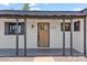 Welcoming front entrance with a newly painted door and stylish exterior design elements at 6908 E Windsor Ave, Scottsdale, AZ 85257
