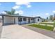 Charming single-story home with front yard landscaping, driveway, and covered parking at 6908 E Windsor Ave, Scottsdale, AZ 85257