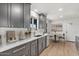 Contemporary kitchen with gray cabinetry, stainless steel appliances, and sleek countertops at 6908 E Windsor Ave, Scottsdale, AZ 85257