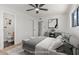 Staged main bedroom with en-suite bathroom, ceiling fan, and contemporary decor at 6908 E Windsor Ave, Scottsdale, AZ 85257