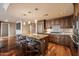 Kitchen with granite countertops, island with seating, custom cabinets and stainless appliances at 7181 E Camelback Rd # 702, Scottsdale, AZ 85251