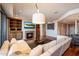Spacious living room featuring a cozy fireplace, hardwood floors, and custom built-ins at 7181 E Camelback Rd # 702, Scottsdale, AZ 85251