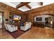 Cozy living room with wood paneling, built-in bookshelves, and a bar for entertaining guests at 7181 E Camelback Rd # 702, Scottsdale, AZ 85251