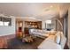 Open concept living area with hardwood floors, a spacious seating area, and modern decor at 7181 E Camelback Rd # 702, Scottsdale, AZ 85251