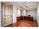 Spacious office with wood floors, a wooden desk and trim and recessed lighting at 7181 E Camelback Rd # 702, Scottsdale, AZ 85251