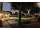 Spacious backyard with a pool, patio area with outdoor kitchen, and low-maintenance landscaping at 7247 W Buckskin Trl, Peoria, AZ 85383