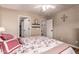 Inviting bedroom showcasing a decorative bed with plush pillows, complemented by neutral walls and charming decor at 7247 W Buckskin Trl, Peoria, AZ 85383