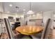 Dining area with wood table, upholstered chairs and kitchen views at 7247 W Buckskin Trl, Peoria, AZ 85383