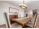 Dining room displaying a wooden table setting with decorative chairs, chandelier and cabinet at 7247 W Buckskin Trl, Peoria, AZ 85383