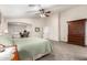 Large main bedroom with a sitting area and a view of a home office, creating a versatile space at 7247 W Buckskin Trl, Peoria, AZ 85383