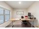 Cozy home office with a large window, providing a bright and productive workspace at 7247 W Buckskin Trl, Peoria, AZ 85383