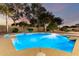 Backyard pool with desert landscaping and plenty of patio space for outdoor lounging at 7247 W Buckskin Trl, Peoria, AZ 85383