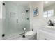Updated bathroom featuring a glass enclosed shower and marble tiling at 7440 E Hubbell St, Scottsdale, AZ 85257
