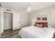 Comfortable bedroom featuring wood floors, neutral paint and an adjacent bathroom at 7440 E Hubbell St, Scottsdale, AZ 85257