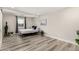 Minimalist bedroom with light wood floors, recessed lighting, and ample sunlight at 7440 E Hubbell St, Scottsdale, AZ 85257