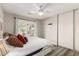 Comfortable bedroom featuring wood floors, neutral paint and French doors leading to the backyard at 7440 E Hubbell St, Scottsdale, AZ 85257