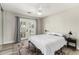 Comfortable bedroom featuring wood floors, neutral paint and French doors leading to the backyard at 7440 E Hubbell St, Scottsdale, AZ 85257