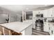 Bright kitchen with a large island, stainless steel appliances, and modern cabinetry at 7440 E Hubbell St, Scottsdale, AZ 85257