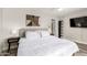 Comfortable main bedroom with a king bed, modern decor, and ample lighting at 7440 E Hubbell St, Scottsdale, AZ 85257