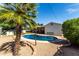 View of the backyard pool surrounded by gravel and lush landscaping at 7440 E Hubbell St, Scottsdale, AZ 85257