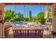 Relaxing backyard with a beautiful pool, lush landscaping, and comfortable seating areas at 7722 W Michigan Ave, Glendale, AZ 85308