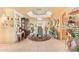 Bright dining room boasts tile floors, chandelier lighting, and seating for six at 7722 W Michigan Ave, Glendale, AZ 85308