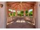 Charming gazebo featuring a cozy seating area with views of lush greenery and natural light at 7722 W Michigan Ave, Glendale, AZ 85308