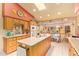 Spacious kitchen has an island with bar seating and lots of cabinet space at 7722 W Michigan Ave, Glendale, AZ 85308