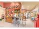 Open kitchen offers an island with bar seating and views of the breakfast nook at 7722 W Michigan Ave, Glendale, AZ 85308