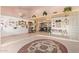 Spacious living room with tile flooring, custom ceilings, and elevated sitting areas at 7722 W Michigan Ave, Glendale, AZ 85308