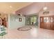 Open concept living room featuring tile flooring, custom ceilings and natural light at 7722 W Michigan Ave, Glendale, AZ 85308